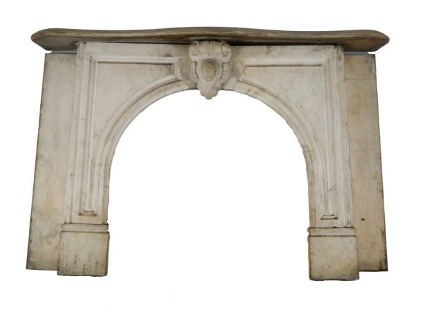 original early 1870's salvaged chicago interior residential white carrara marble fireplace mantel with arch top opening and ornamental keystone 