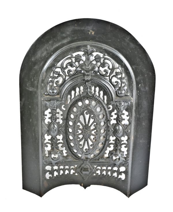 early 1870's ornamental cast iron salvaged chicago arch top interior residential fireplace perforated summer cover with a mostly uniform black enameled finish 