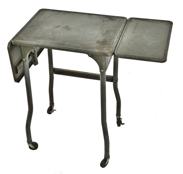original and intact c. 1940's american industrial mobile four-legged pressed and folded steel toledo typewriter stand with opposed drop leaves