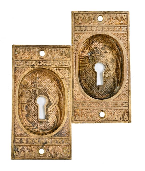 two matching original and intact 1880's cast bronze "broken leaf" american aesthetic movement pocket door backplates with deeply recessed cups containing keyholes
