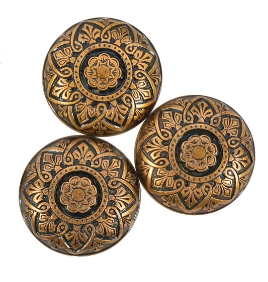 three matching ornamental cast brass interior residential american victorian era banded rim brass doorknobs with largely intact black enameled inlay