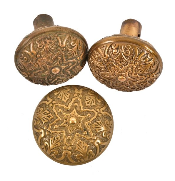 group of three original 19th century ornamental cast brass interior residential "star" pattern american antique interior residential doorknobs with banded rims and palmettes  