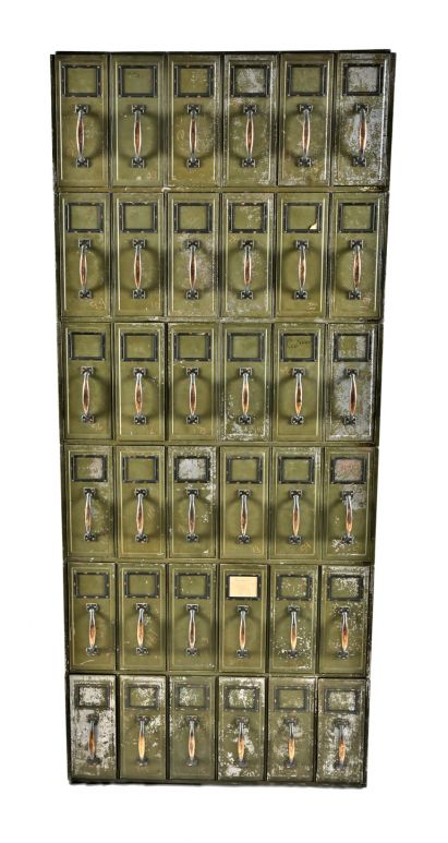 original and completely intact freestanding early 20th century chicago city hall "fire proof" reinforced steel army green enameled multi-drawer filing cabinet with oxidized copper handles