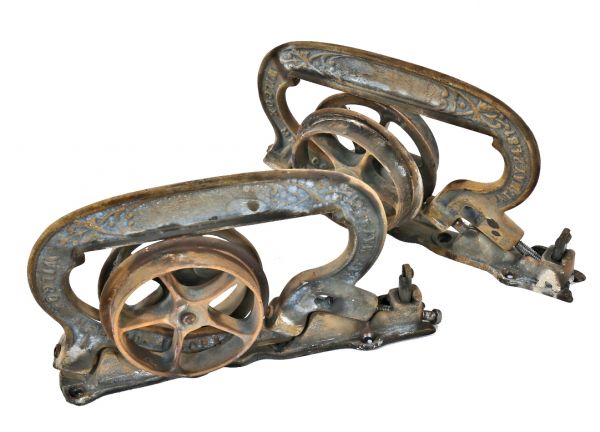 late 19th century hard to find original interior residential ornamental cast iron single pocket door brackets or hangers with rollers and base plates