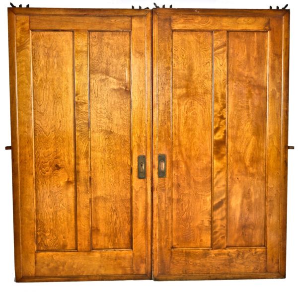 original and well-maintained c. 1920's logan square masonic temple building interior birch wood pocket doors with intact varnished finish 