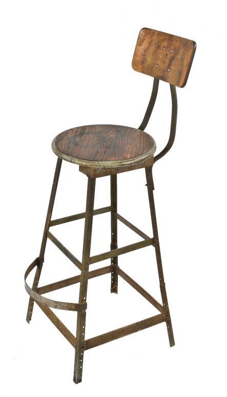 robust 1940's pollard brothers four-legged riveted and welded angled steel factory stationary stool with contoured backrest and foot rest 