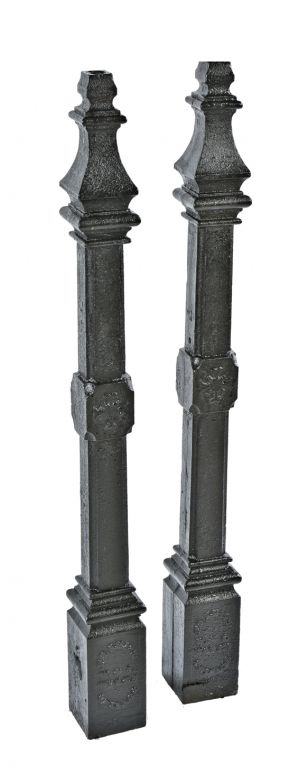 matching set of original black enameled gothic style cast iron ornamental salvaged chicago newel posts with a uniform black enameled finish 