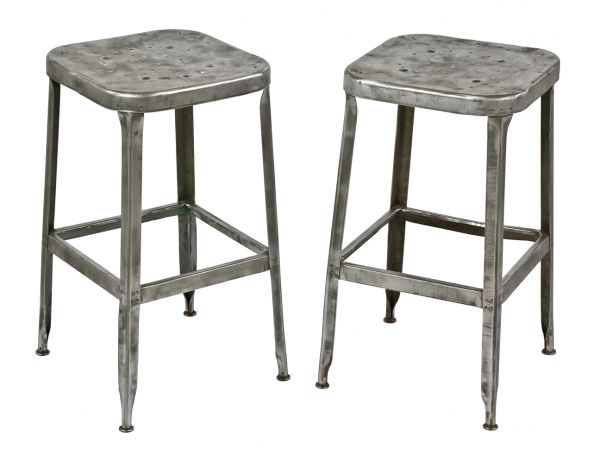 pair of matching refinished brushed metal c. 1950's salvaged chicago factory pressed and folded steel lyon stools with clear coat finish 