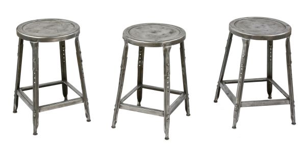 group of three matching refinished brushed metal c. 1950's salvaged chicago adjustable height factory pressed and folded steel lyon stools with clear coat finish 
