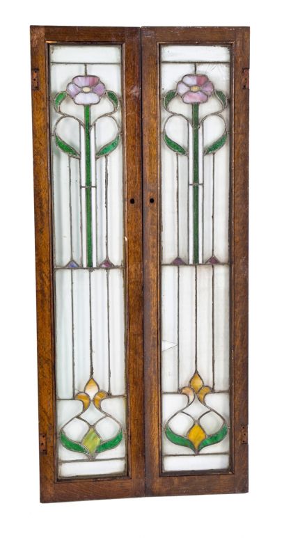 pair of original early 20th century american art glass interior residential cabinet door windows accentuated with elegantly designed art glass floral motifs 
