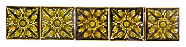 group of five original and intact c. 1880's salvaged chicago olive green majolica glazed interior residential fireplace tiles with embossed flowers 