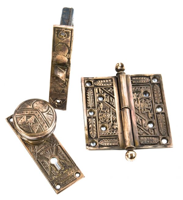 group of incredible 19th century antique american salvaged chicago ornamental cast brass residential door hardware with functional mortise lock and loose pin hinge