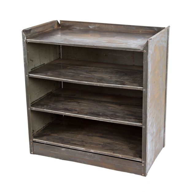 reinforced vintage american industrial pressed and folded heavy gauge steel chicago factory machine shop oversized shelving unit with a brushed metal finish