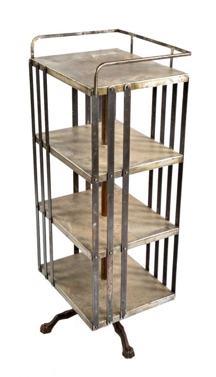 rare all original and fully functional early 20th century antique american industrial freestanding revolving bookstand with steel slats and railguard  