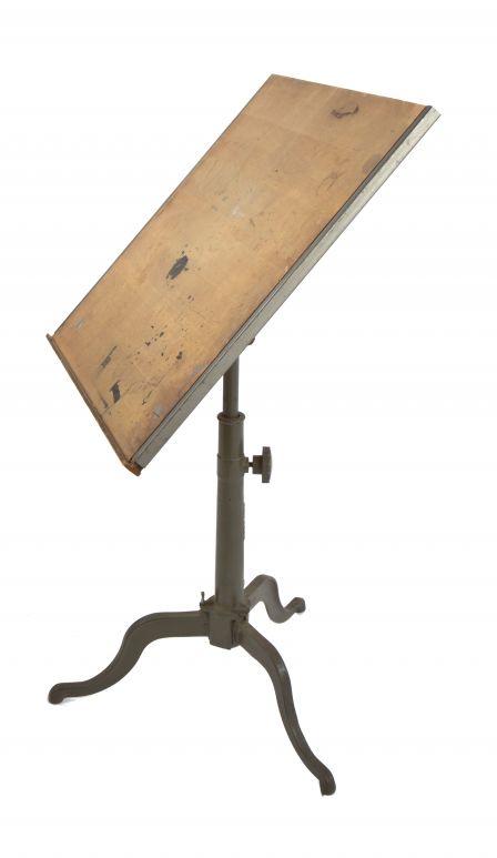 single early 20th century original and intact salvaged chicago cast iron three-legged drafting table with adjustable height telescoping post base