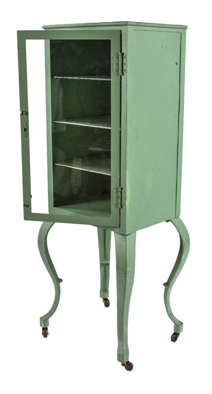 early 20th century fanciful cast iron and cold-rolled heavy gauge steel mobile chicago hospital operating room supply cabinet with original glass shelves 