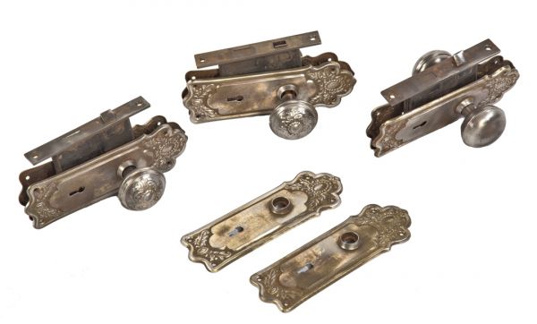 three sets of original pressed steel early 20th century antique american salvaged chicago passage door locksets with fanciful knobs and backplates 