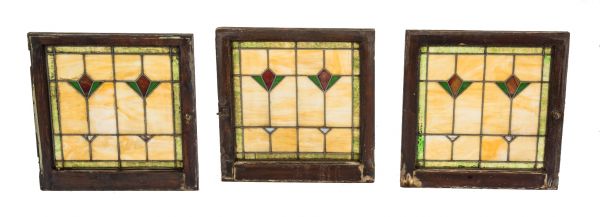 group of three matching early 20th century salvaged chicago leaded art glass bungalow windows featuring richly colored slag glass with abstract floral motifs 