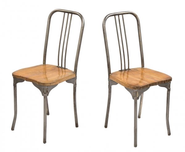 matching set of original american depression era bent tubular steel hospital chairs with original male wood seats and brushed metal finish 