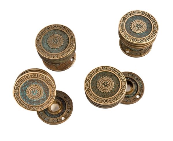 group of four matching original cast brass "ivy" pattern interior residential drum-shaped salvaged chicago passage size eastlake style doorknobs with rosettes  