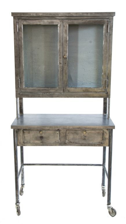 highly desirable early 20th century antique american medical refinished pressed and folded steel medical cabinet with sliding drawers and sidelights 