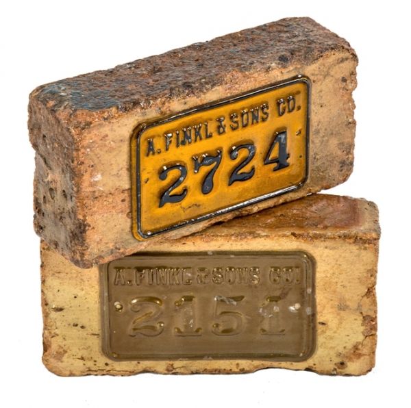 one of three original a. finkl & sons bricks with old inventory plaques salvaged from the company's foundry building after moving to the north side in 1902