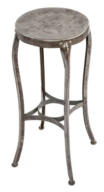 hard to find original early 20th century antique american industrial riveted joint cold-steel "uhl art steel" four-legged industrial stool with flared legs 