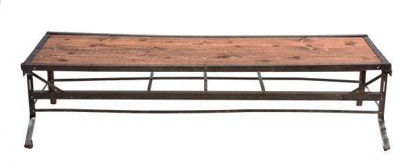 repurposed vintage american industrial low-lying cold-rolled steel riveted joint four-legged machine base coffee table with newly added varnished wood tabletop  