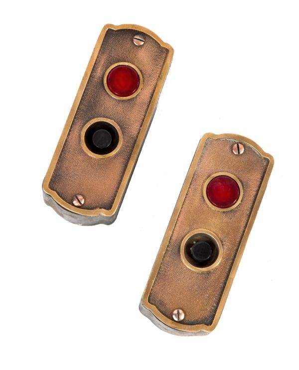two of four matching original early 20th century salvaged chicago american industrial interior factory building flush mount bronze elevator backplates with push buttons and indicator lights
