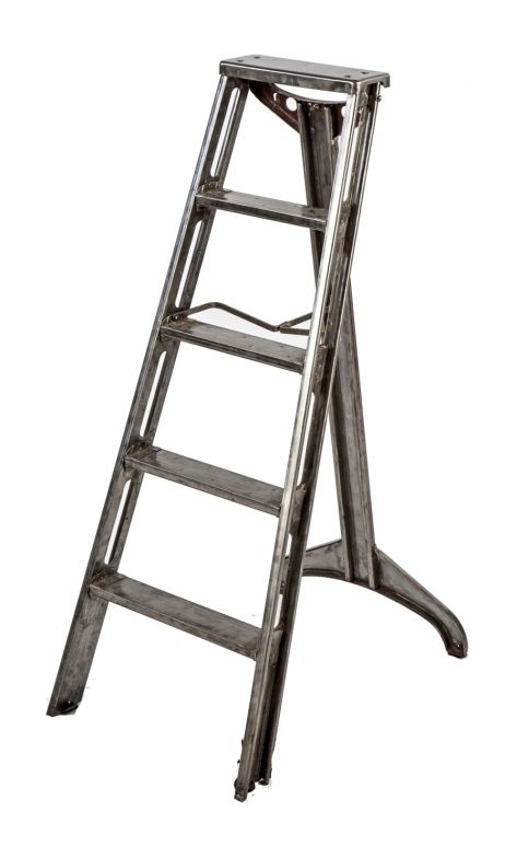 exceptional c. 1930's american industrial refinished brushed and sanded riveted joint collapsible heavy gauge steel ladder with multiple reinforced rungs