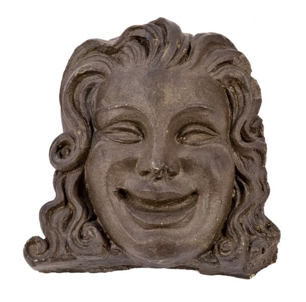 historically important late 1920's american exterior black glazed terra cotta figural dupage theater  facade "comedy" head or mask fragment with flowing hair 