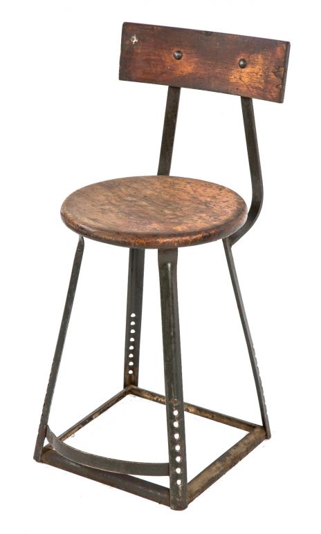 original 1940's vintage american industrial four-legged salvaged chicago factory machine shop stool with solid maple wood seat, contoured backrest, and foot rest
