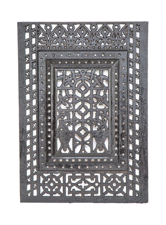 19th century antique american ornamental cast iron eastlake style interior residential fireplace summer cover or grille with largely uniform black enameled finish  