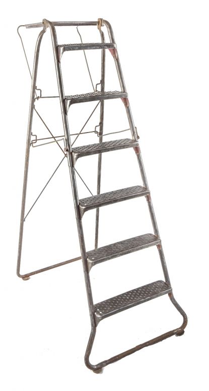 american depression era antique industrial reinforced tubular brushed metal collapsible ladder with riveted joint rungs or steps and oversized raised edge tray