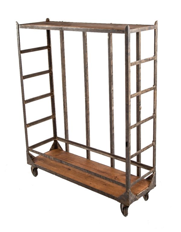 original early 20th century brushed metal angled steel american salvaged chicago garment factory shelving unit or cart with fully functional casters and adjustable wood shelves 