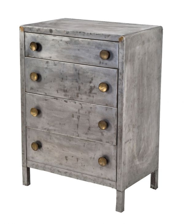 original multi-drawer american industrial pressed and folded steel dresser cabinet with intact oversized circular-shaped brass drawer pulls 
