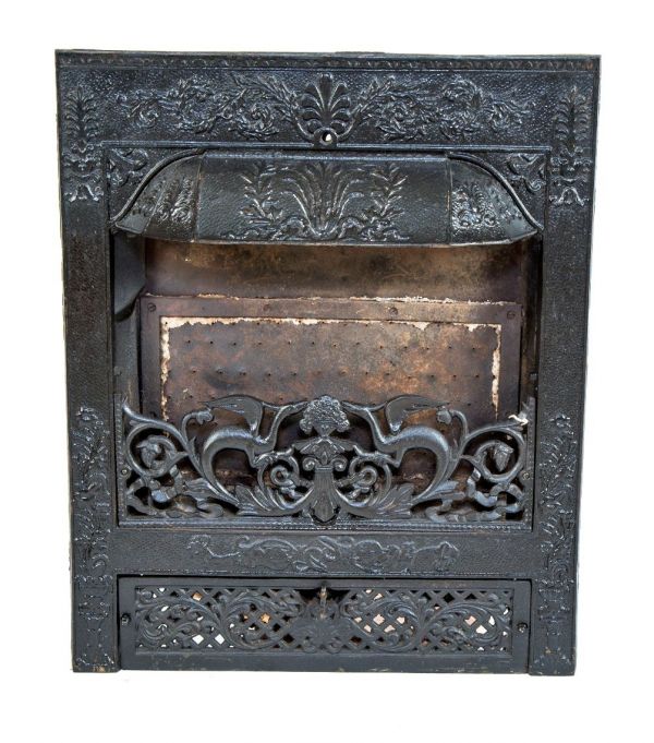 exceptional antique american dawson brothers interior residential ornamental cast iron salvaged chicago fireplace insert with mostly uniform black enameled finish and winged dragon grille 