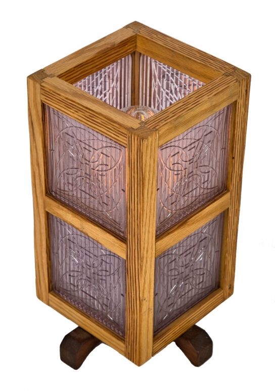 one of several matching repurposed single electric light table or desk lamp with custom-built wood surround accentuated with original early 20th century frank lloyd wright-designed prism tiles
