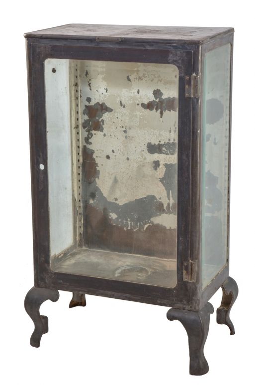 highly slight after early 20th century oversized cast iron and steel hospital operating room medical supply cabinet with cabriole legs and large beveled panes of glass 