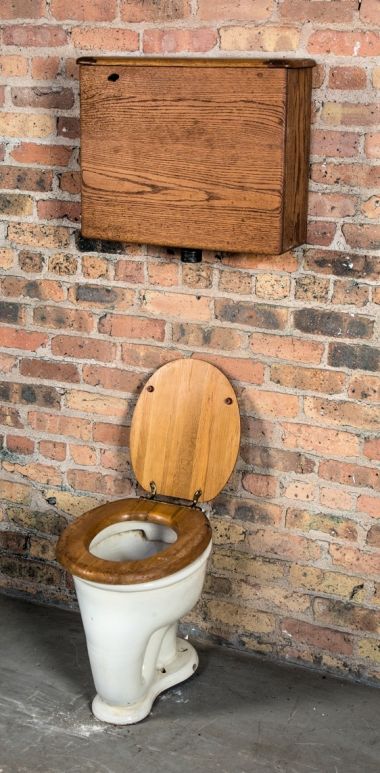 restored late 19th or early 20th century antique american salvaged chicago interior residential lavatory water closet or toilet with copper-lined oak wood tank