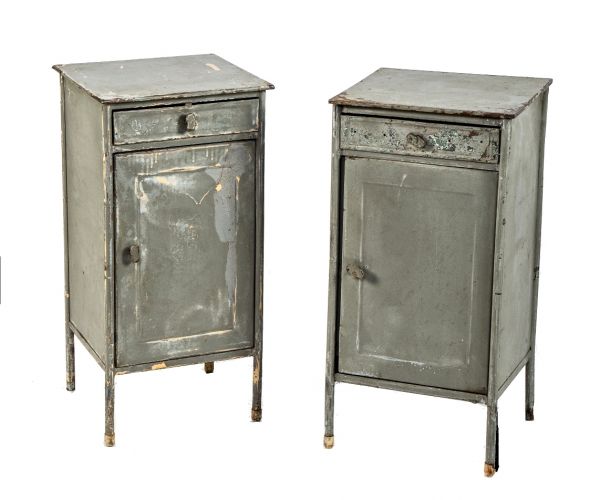 two matching c. 1930's freestanding weathered and worn industrial enameled steel side table with single drawers and cabinet doors 