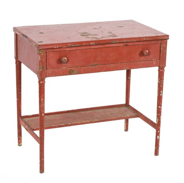 hard to find and nicely distressed old red paint finish over steel simmons four-legged desk with single pull-out drawer