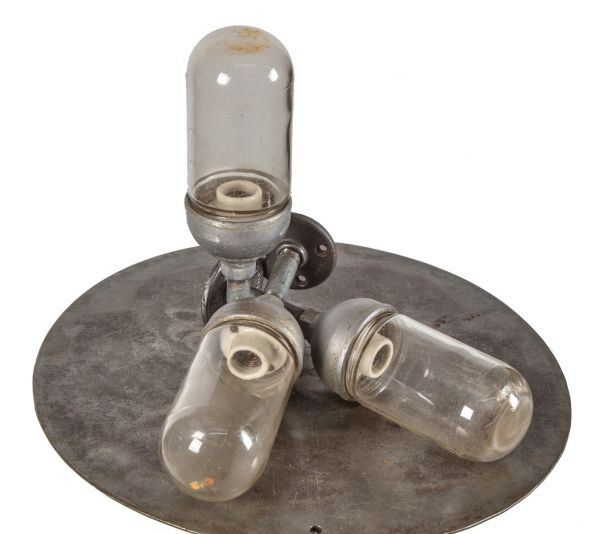 one of three matching original salvaged chicago grain elevator "explosion proof" appleton pendant lights with clear threaded glass bulb guards