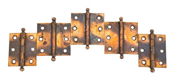 recently acquired group of salvaged oxidized copper diminutive cabinet door hinges from medical cabinet door