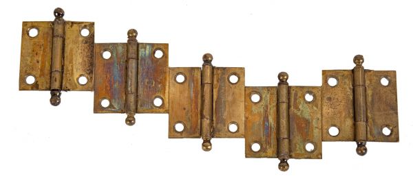group of three antique american brass-plated wrought steel diminutive cabinet door hinges with intact ball finials