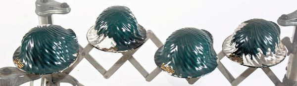 group of three green enameled national x-ray "eye comfort" ribbed glass reflectors salvaged from a chicago storefront