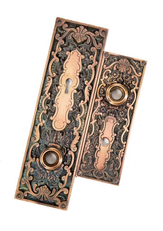 seldom found all original and remarkable well cast ornamental bronze russell and erwin doorknob backplates with nicely aged surface patina