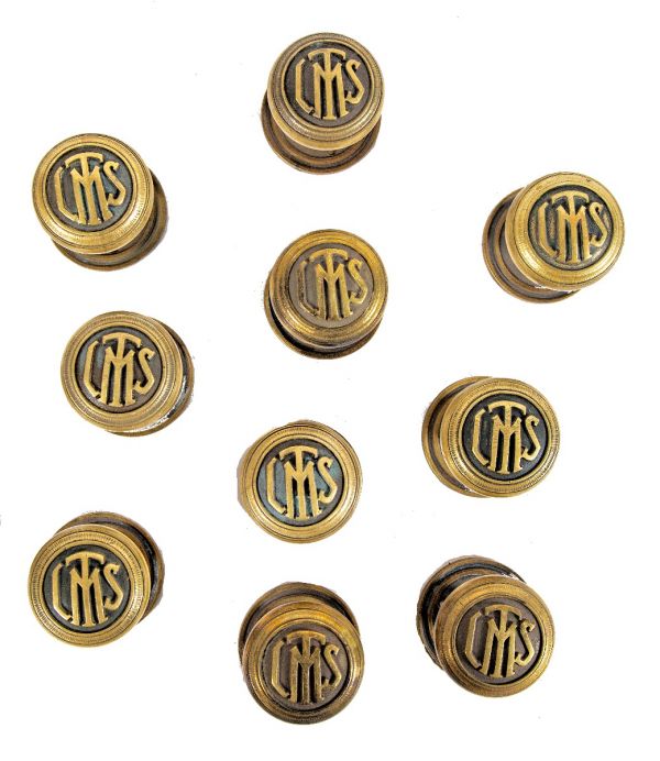 group of ten matching original 1920s logan square masonic temple cast brass monogrammed doorknobs with matching rosettes and keyplates