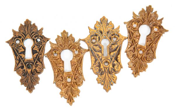 four matching 1870s pf. corbin or russell and erwin american high victorian oversized cast bronze passage door keyhole backplates