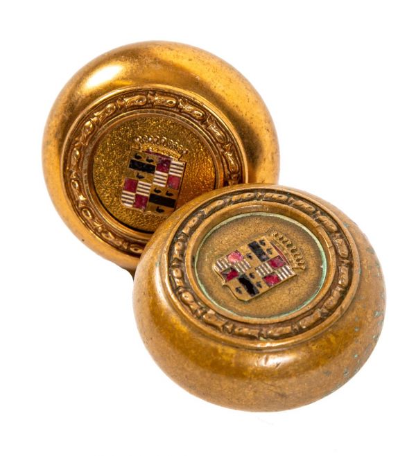 matching set of original historically important book cadilac hotel interior guestroom doorknobs comprised of bronze with baked enameled accent 